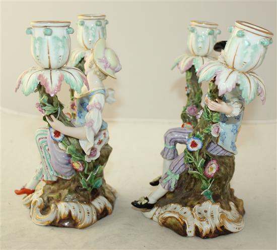 A pair of Meissen figural candelabra, later 19th century, height 19.5cm, typical minor losses to flowers